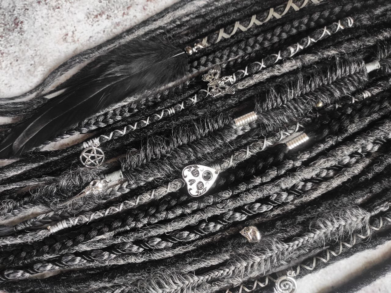 black and dark grey synthetic dreads with braids and goth jewelry
