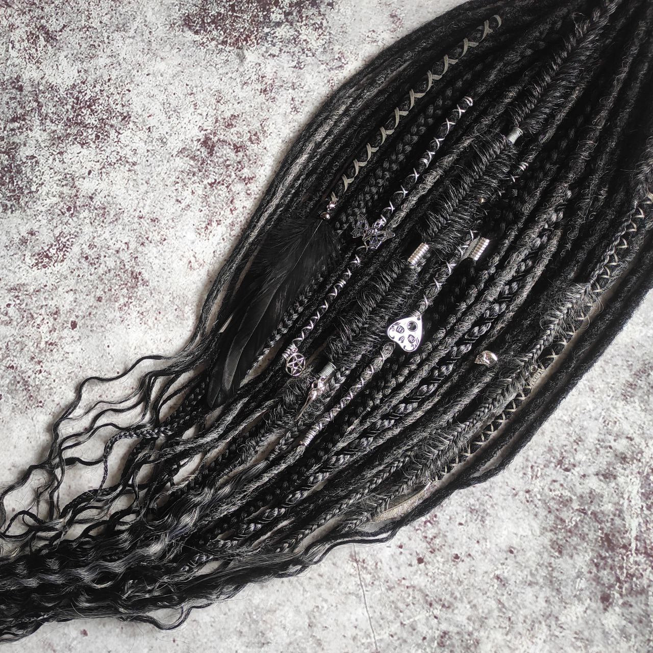 black and dark grey synthetic dreads with braids and goth jewelry