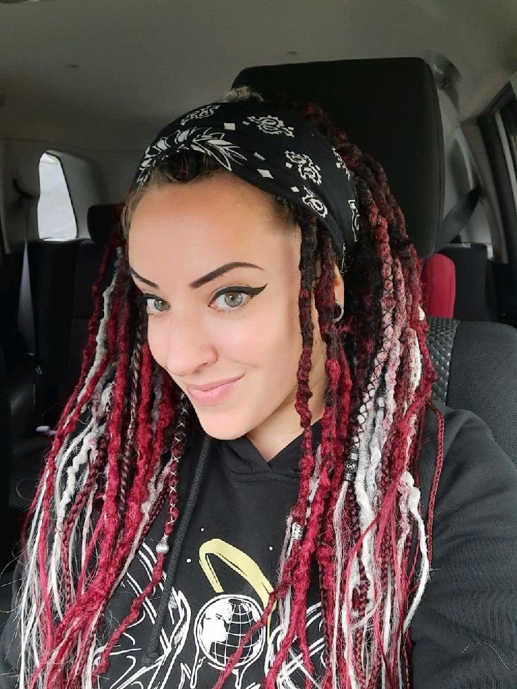 Girl with Black to Red and Grey Ombre Synthetic Dreads with Braids.