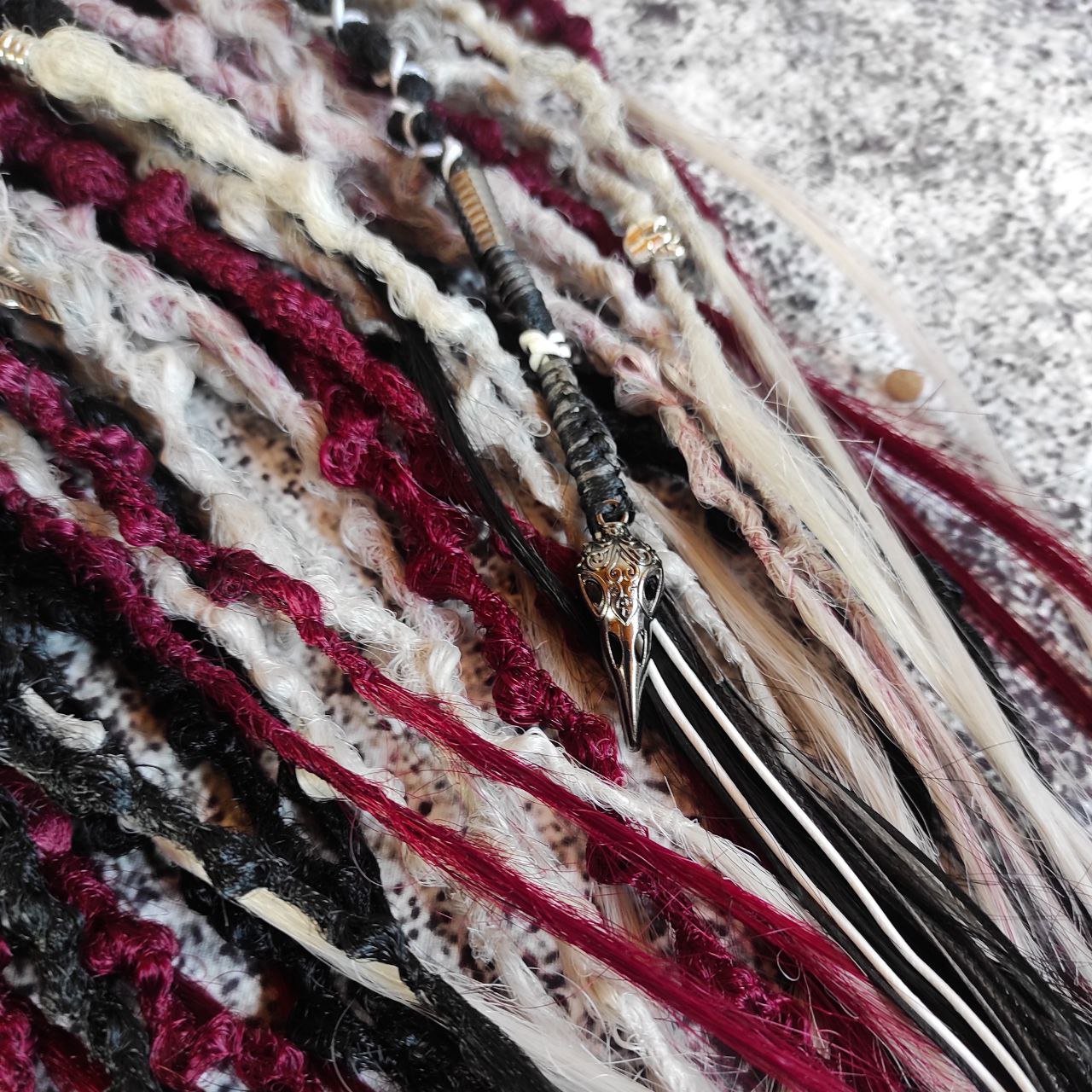 Synthetic 30-double-ended dreads in a solid black shade transitioning to red and grey ombre