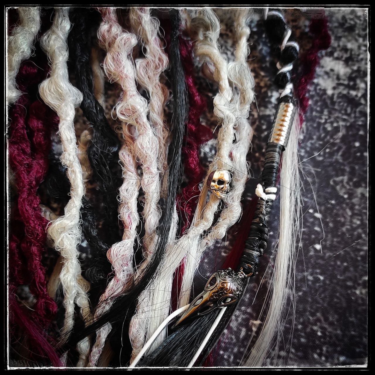 Synthetic 30-double-ended dreads in a solid black shade transitioning to red and grey ombre