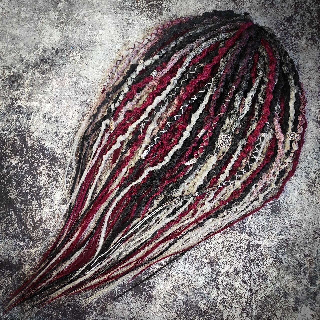 Synthetic 30-double-ended dreads in a solid black shade transitioning to red and grey ombre