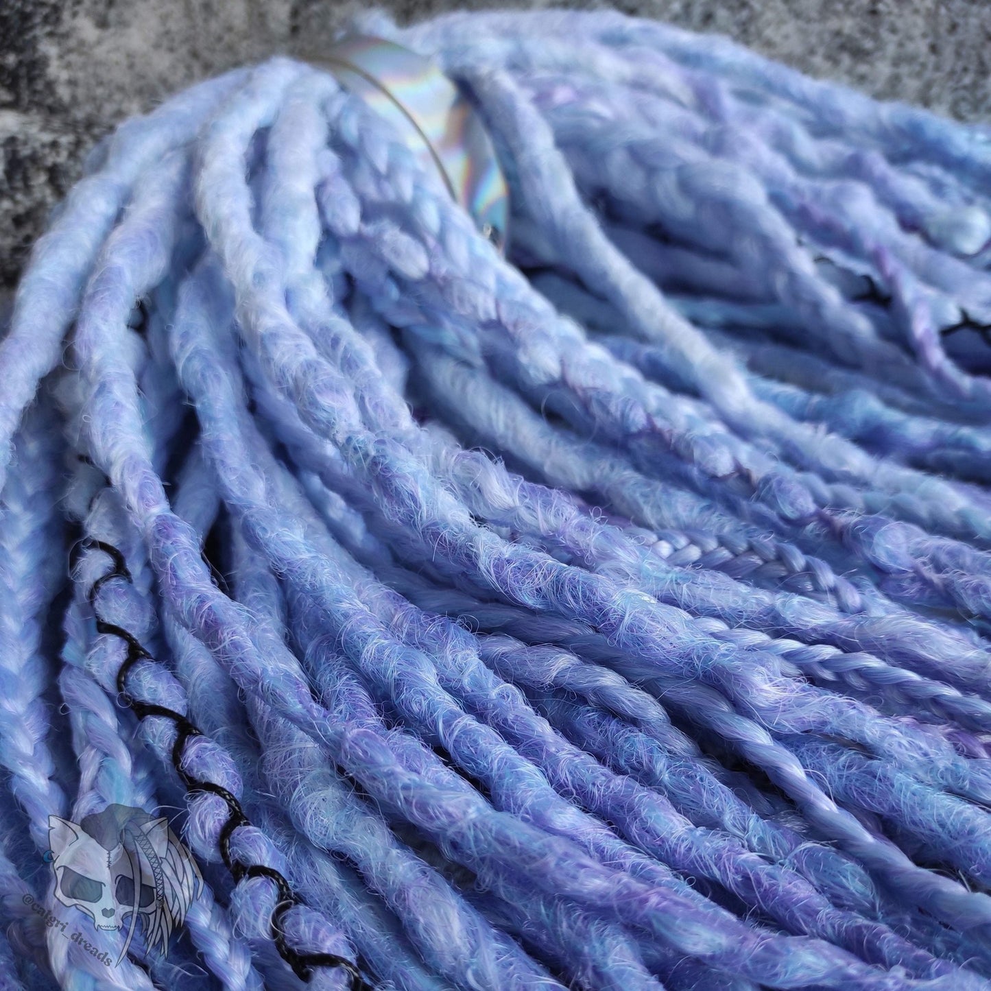 Custom ombre synthetic dreads with braids, transitioning from white to purple