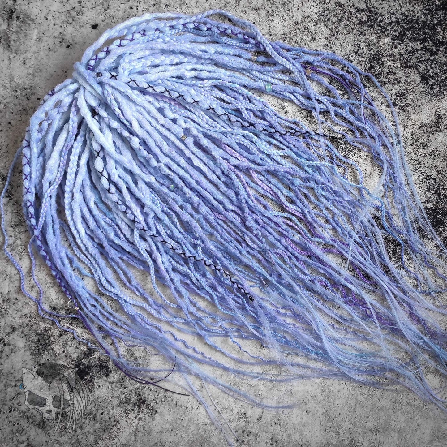 Custom ombre synthetic dreads with braids, transitioning from white to purple