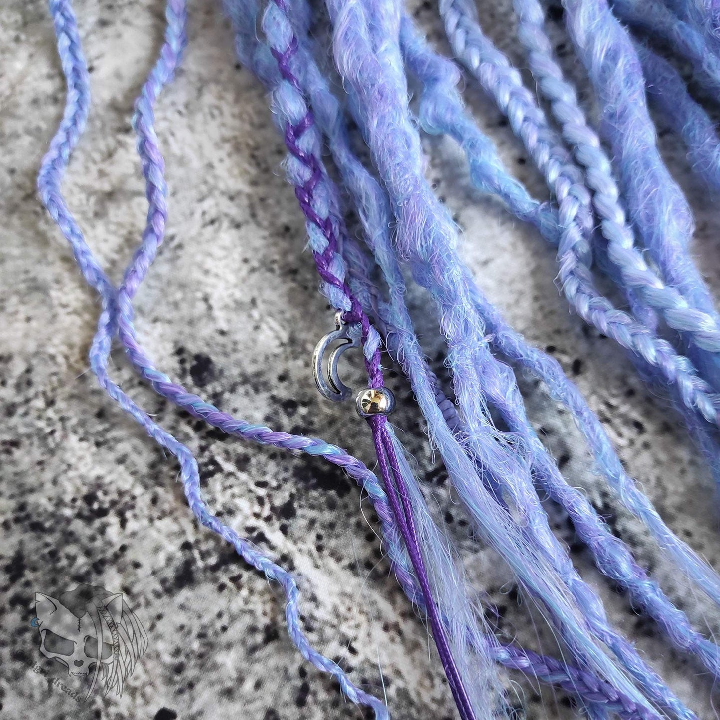 Custom ombre synthetic dreads with braids, transitioning from white to purple
