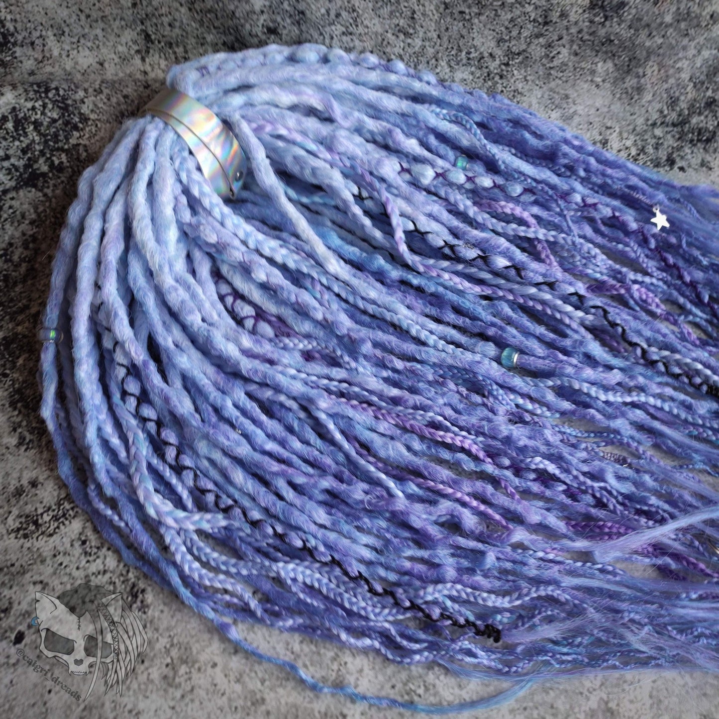 Custom ombre synthetic dreads with braids, transitioning from white to purple