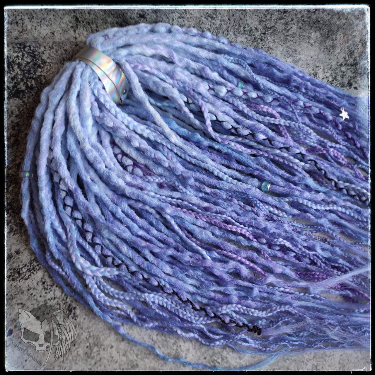 Custom ombre synthetic dreads with braids, transitioning from white to purple