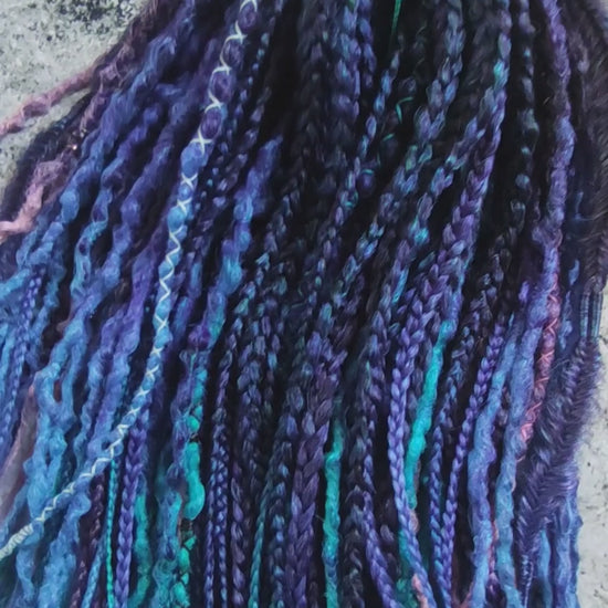 Purple synthetic dreads featuring brown-to-pink, turquoise, and blue ombre extensions, along with braids - Video