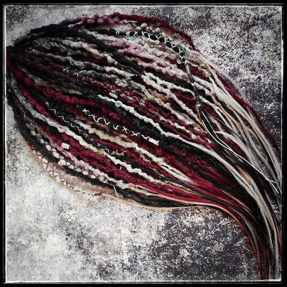 Solid black synthetic dreads transitioning into a red and grey ombre, available in a set of 30 double-ended dreads