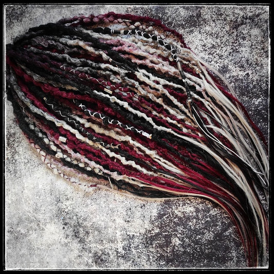 Solid black synthetic dreads transitioning into a red and grey ombre, available in a set of 30 double-ended dreads