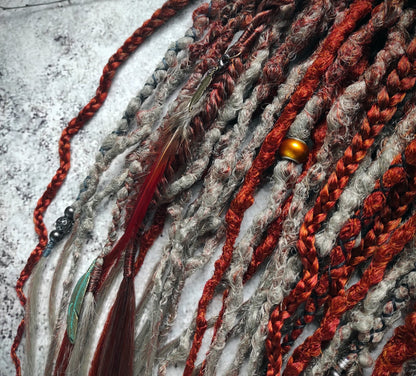 Synthetic dreads featuring a red auburn ombre transitioning to gray, complemented by braids