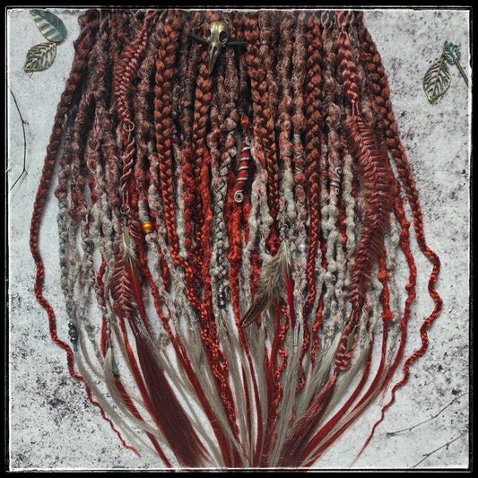 Synthetic dreads with an ombre transition from red auburn to gray, complemented by braids.