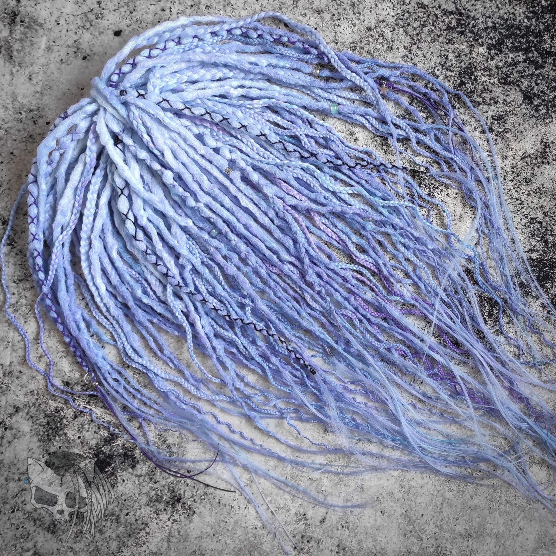 Custom ombre synthetic dreads with braids, transitioning from white to purple