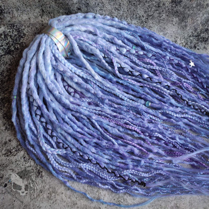 Custom ombre synthetic dreads with braids, transitioning from white to purple