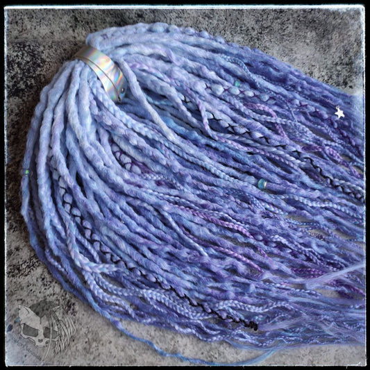 Custom ombre synthetic dreads with braids, transitioning from white to purple